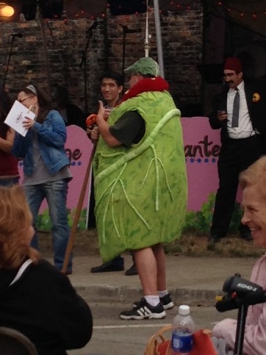 Man in a Stuffed Cabbage Roll costume.