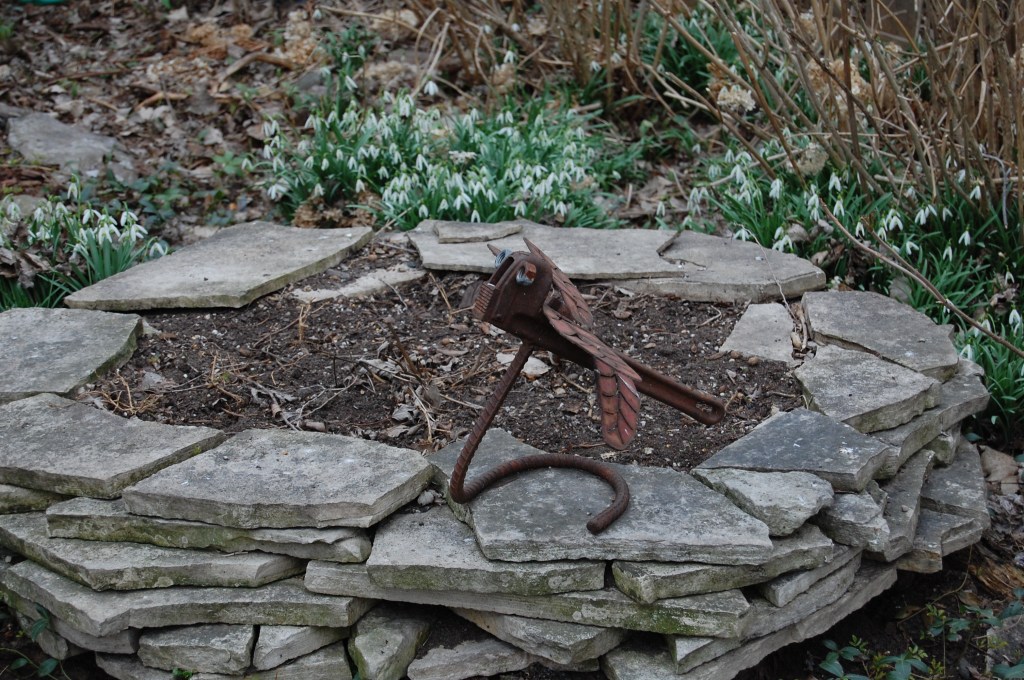 Dragonfly/wrench with snowdrops.