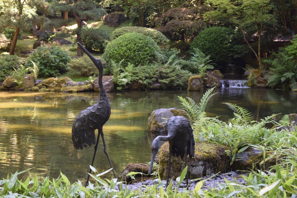 The upper pond of the Strolling Pond Garden. I wanted to steal these bird  (heron?) statues.